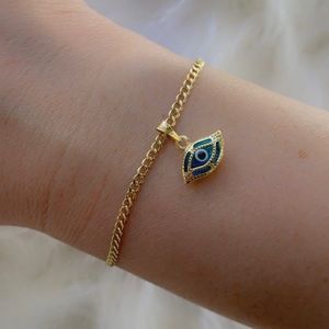 10K gold blue evil eye charm bracelet